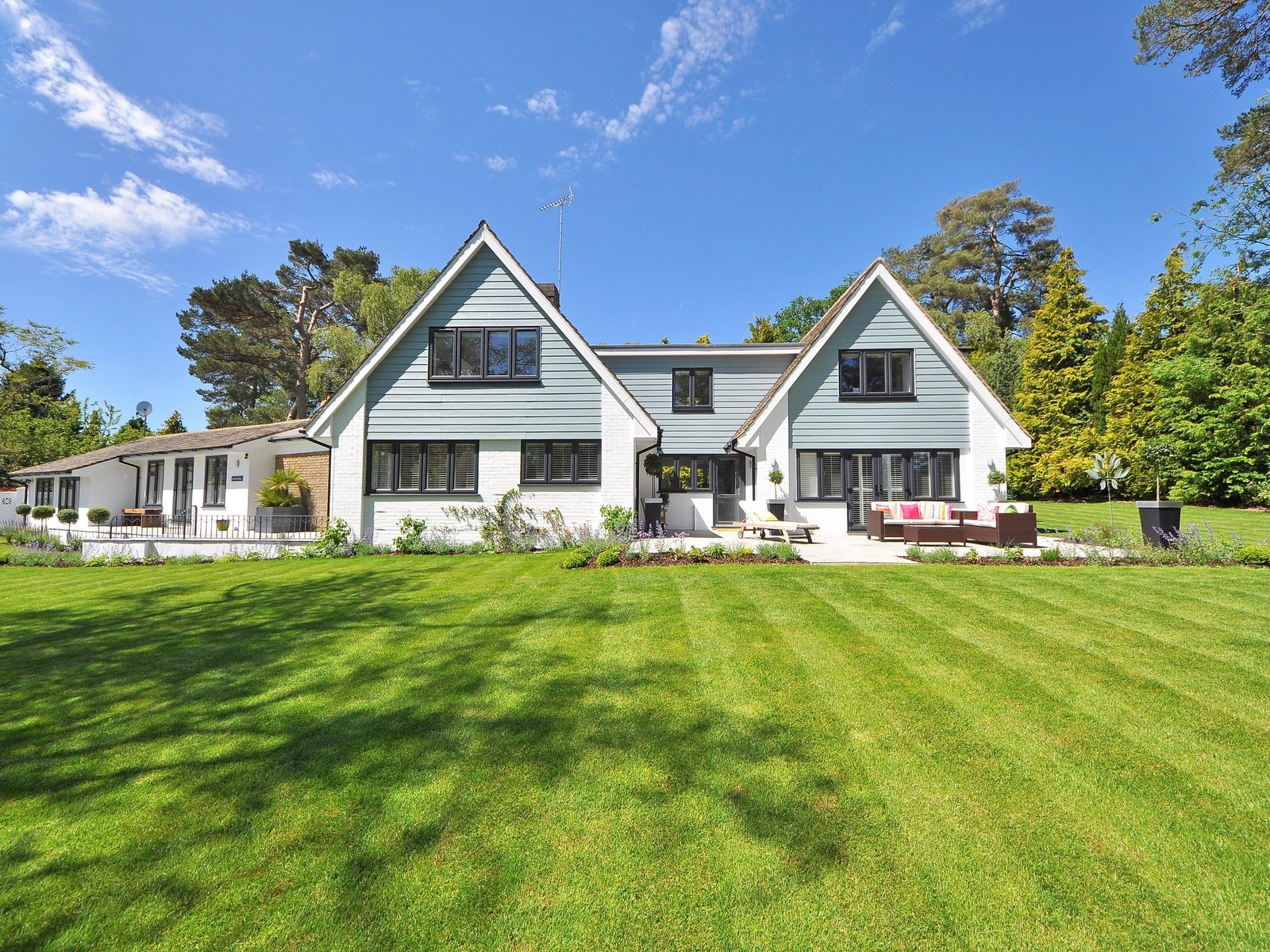Freshly mowed lawn with clean stripe lines in front of a Rochester home